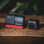 Action Cameras - black and orange camera on brown surface