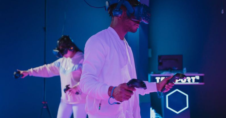 VR Headsets - Man Playing a Video Game while Wearing a VR Headset