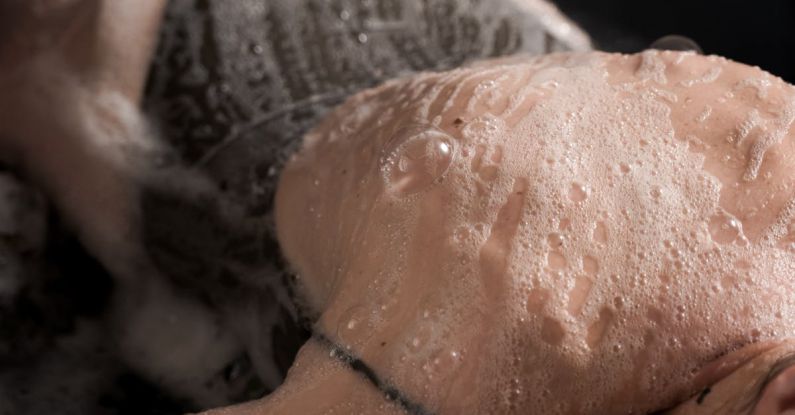 SSDs - An Elderly Woman Back Wet with Bubbles